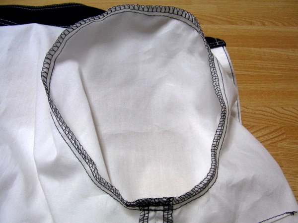 Finishing sleeve seams by serging/overlocking around the armhole