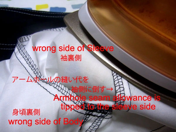 Ironing the armhole using a sleeve ironing board for a neat finish