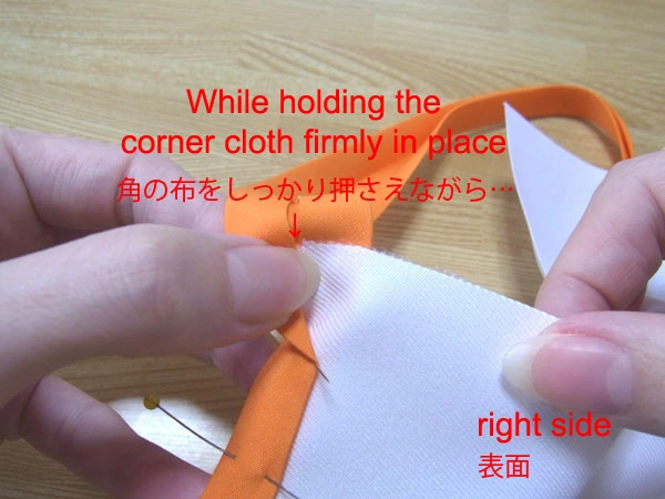 Hold the corner cloth firmly in place