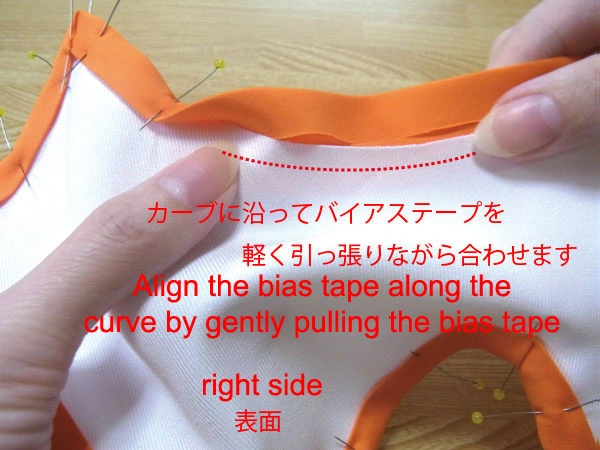Align bias tape along the curve by gently pulling