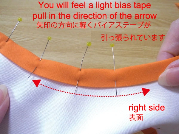 Fasten bias tape with a marking pin after aligning