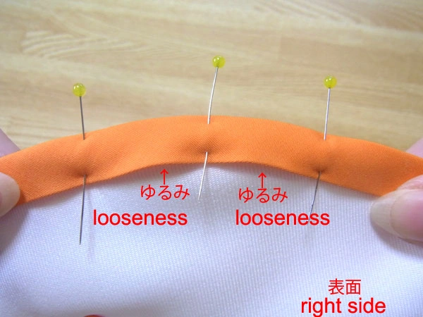 Fasten bias tape with pins on a curved part
