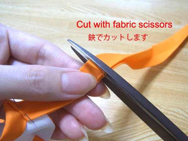 Cutting bias tape to length with fabric scissors