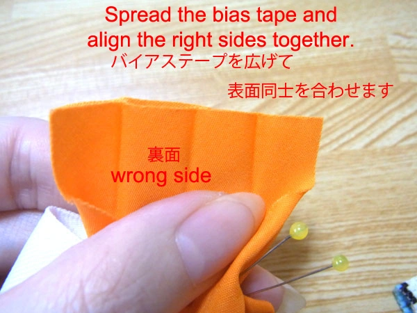 Aligning bias tapes right side together before sewing