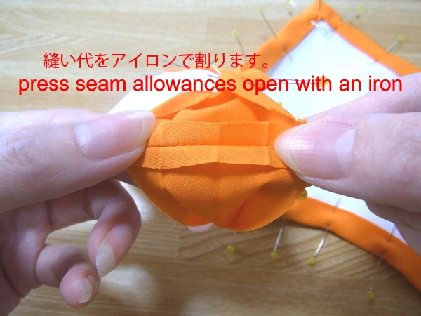 Pressing seam allowances open with an iron