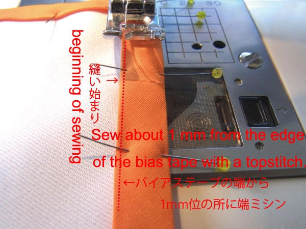 Sewing around 1 mm from the edge of the bias tape