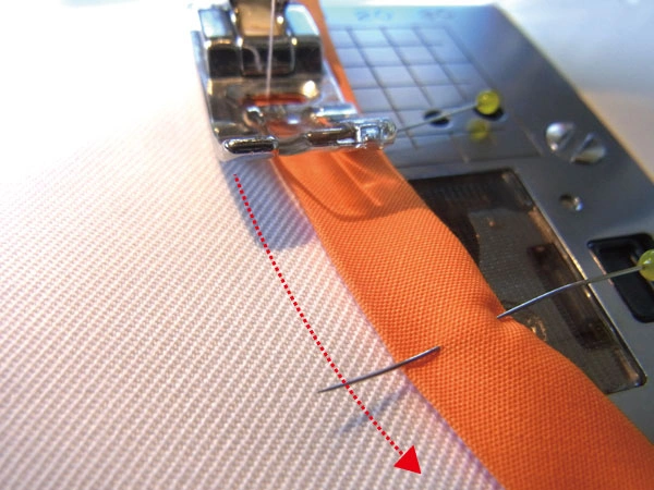 Sewing along a curved portion of the fabric