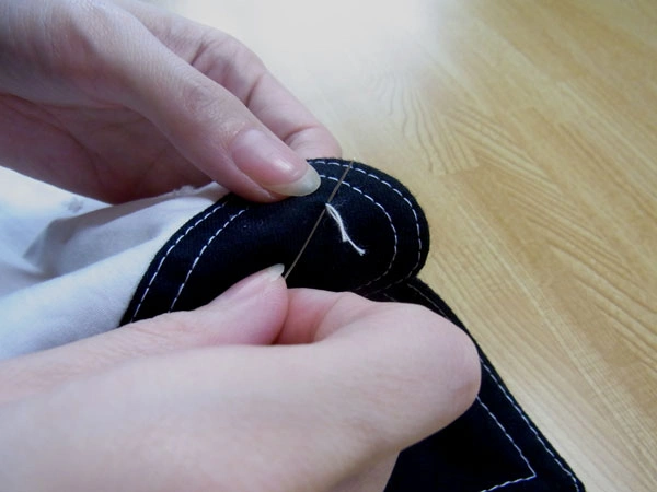 Blind stitching button position