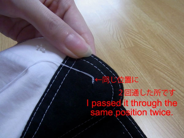 Threading the needle twice to secure without knot