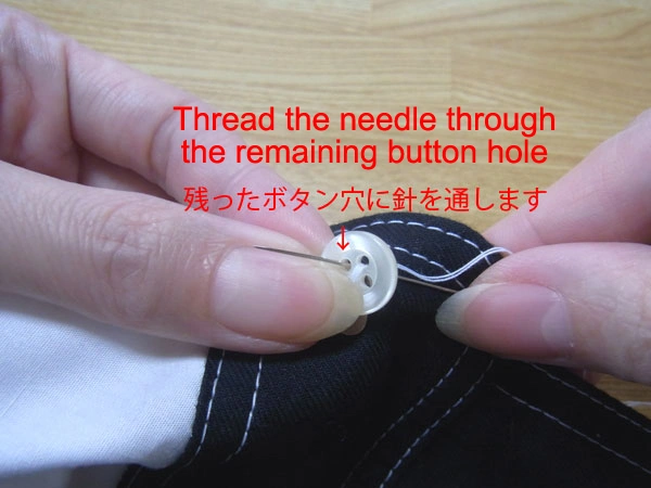 Starting to sew remaining holes of button
