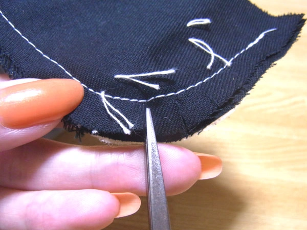 Removing basting stitches with thread remover