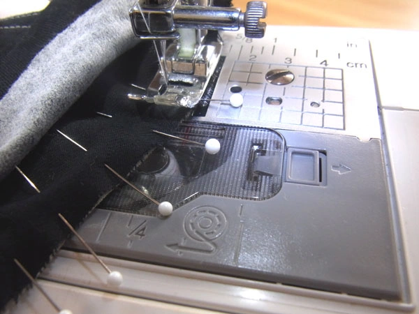 Collar stand fully pinned to neckline