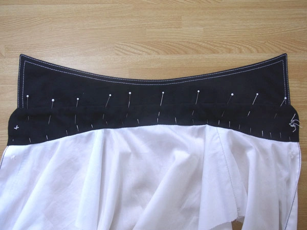 Pinning collar stand corners while hiding seams