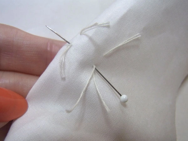 Folding dart tip and pinning it