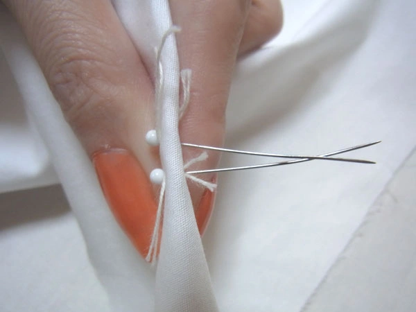 Passing an additional pin through dart marks