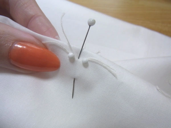 Folding dart to align stitch lines