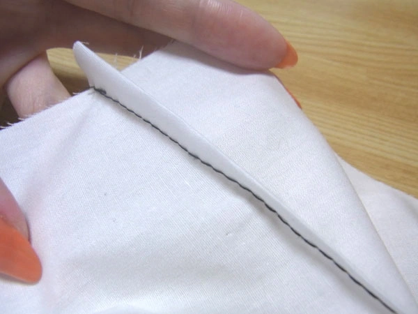 Pulling out basting thread with a pointed remover