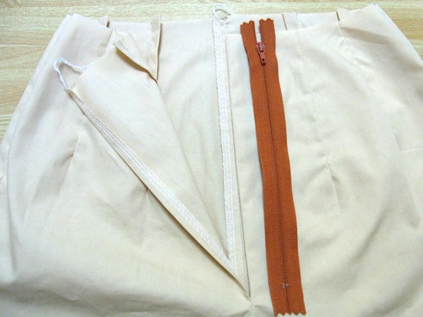 Start sewing zipper to pants