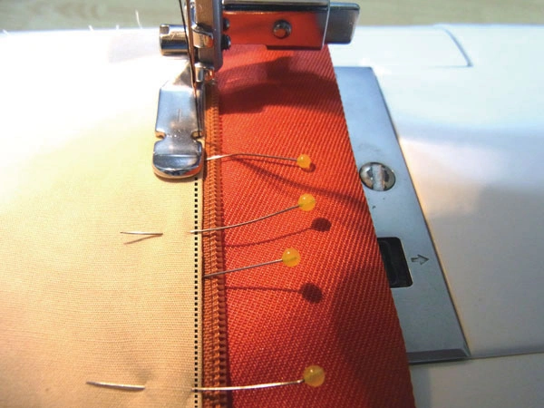 Sew with cording foot 1.5 to 2mm from edge