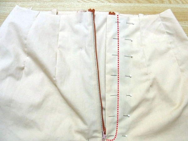 Sew front pants and facing together with red dotted line