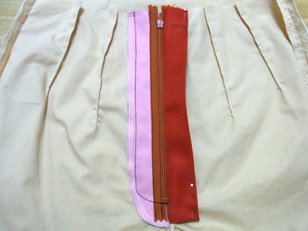 Inside view of sewn zipper and facing