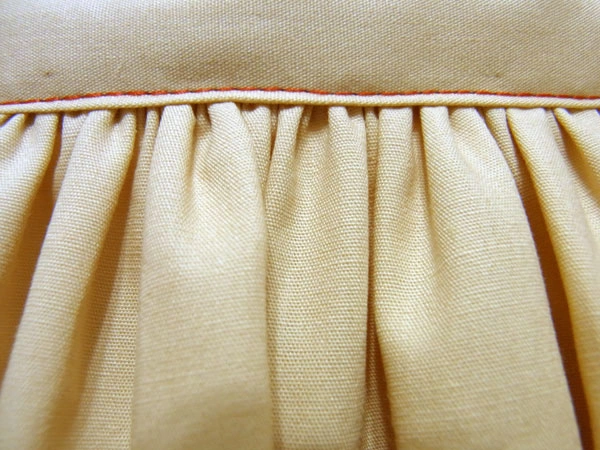 Close-up showing neatly sewn gathers
