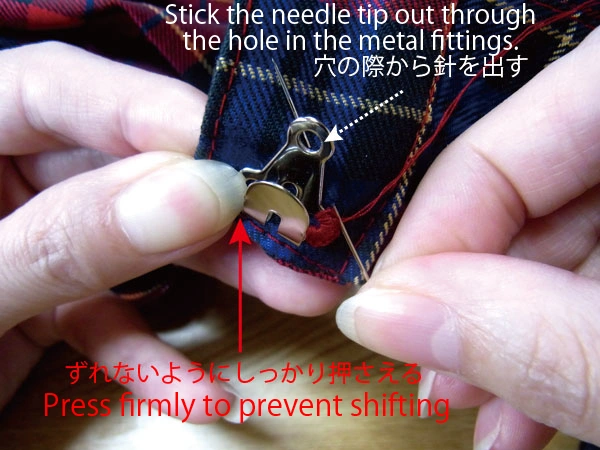 Holding hook in place while sewing adjacent hole