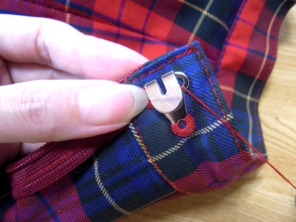 Thread passing through final hook hole