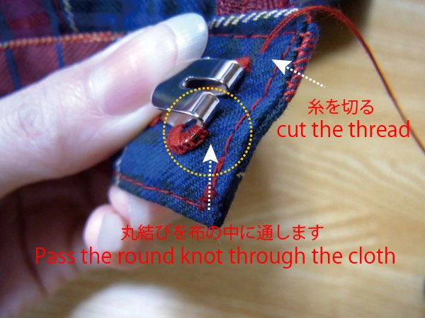 Pulling knot inside waistband fabric