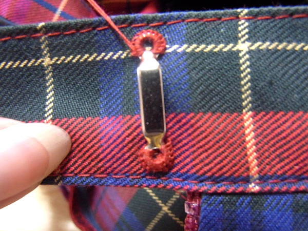 Finishing sewing bar eye before tying knot