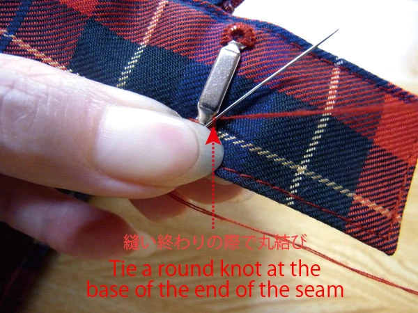Tying round knot to finish bar eye sewing