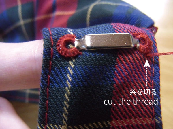 Cutting thread after hiding knot in fabric