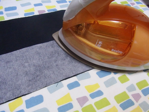 Applying fusible interlining to the cuff