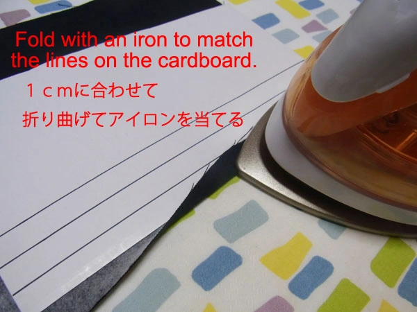 Cardboard tool for ironing accurate folds