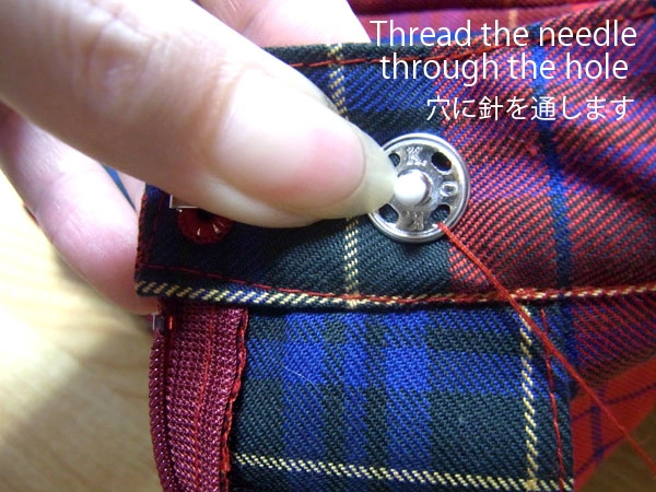 Sewing through snap part hole with needle