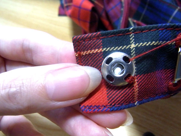 Continuing sewing through snap holes