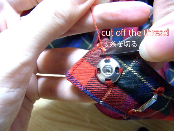 Cutting excess thread with thread clippers