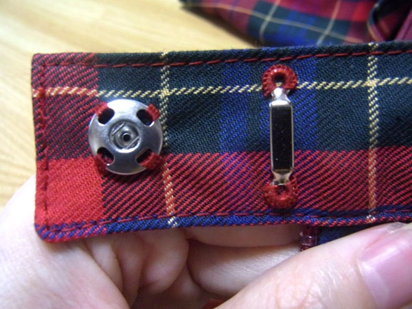 Female snap part sewn in place
