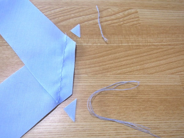 Trim triangle edges and loose threads after sewing