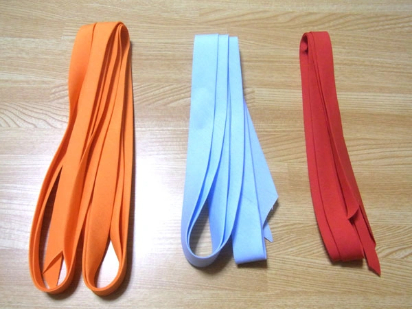 Completed bias tapes in three colors and sizes